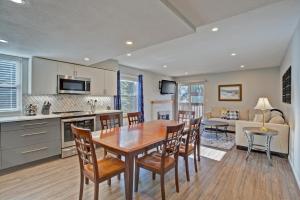 a kitchen and living room with a wooden table and chairs at Mountainside #272H in Frisco