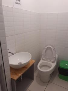 a bathroom with a toilet and a sink at Marvelous Hostel Cusco in Cusco