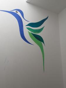 a painting of a bird on a wall at Marvelous Hostel Cusco in Cusco