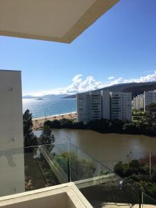 a view of a body of water from a building at Departamento Papudo Laguna Vista al Mar y Laguna in Papudo
