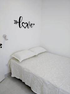 Ένα ή περισσότερα κρεβάτια σε δωμάτιο στο Departamentos Necochea Playa