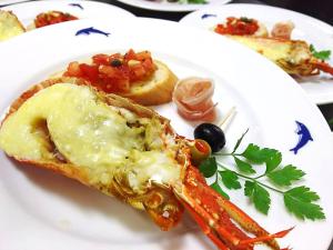 a white plate of food with a slice of pizza at Kamo-gun - Hotel / Vacation STAY 50723 in Okawa