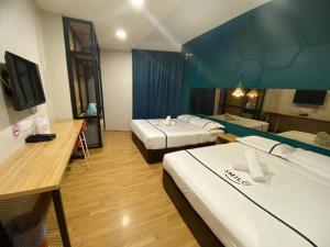 Postel nebo postele na pokoji v ubytování Smile Hotel Selayang Point