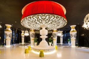 a large red and white lamp on a table at Zetter Suite Arte Mont Kiara in Kuala Lumpur