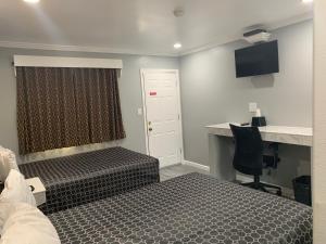 Llit o llits en una habitació de Colusa Motel