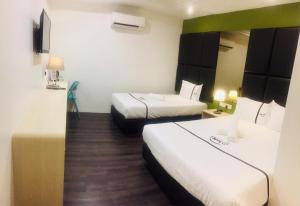 Postel nebo postele na pokoji v ubytování Seeds Hotel Ampang Point