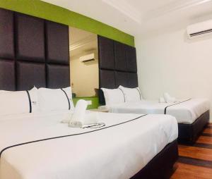 Postel nebo postele na pokoji v ubytování Seeds Hotel Ampang Point