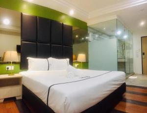 Postel nebo postele na pokoji v ubytování Seeds Hotel Ampang Point