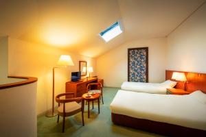 Postel nebo postele na pokoji v ubytování Hotel Io Alpheratz + 30 fotografií
