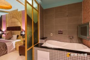 Postel nebo postele na pokoji v ubytování Zheng Yi Hotel & Motel I + 37 fotografií
