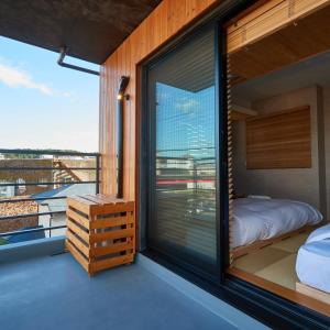 Postel nebo postele na pokoji v ubytování KAMAKURA Hotel