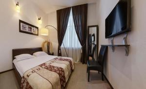Postel nebo postele na pokoji v ubytování Reno Hotel