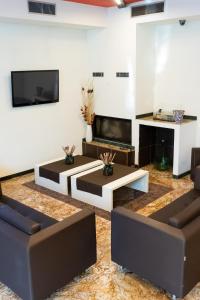 TV a/nebo společenská místnost v ubytování Hotel Fiera Rho
