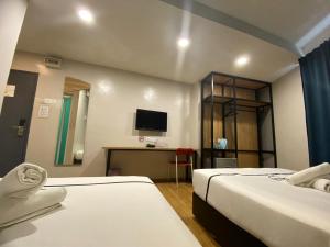 Postel nebo postele na pokoji v ubytování Smile Hotel Selayang Point