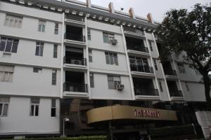 a white building with windows and balconies at The Sonnet Jamshedpur in Jamshedpur