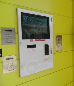 an atm machine on a yellow wall at Copper City Motel in Mount Isa +10 photos