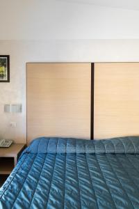 Postel nebo postele na pokoji v ubytování Hotel Fiera Rho