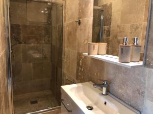 a bathroom with a shower and a sink and a shower at My Pad Provence 3 in Avignon