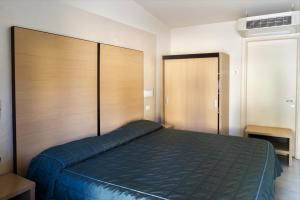 Postel nebo postele na pokoji v ubytování Hotel Fiera Rho