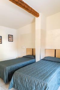 Postel nebo postele na pokoji v ubytování Hotel Fiera Rho
