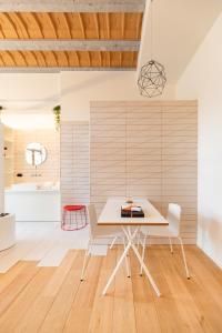 a dining room with a table and chairs at The Hide in Ghent