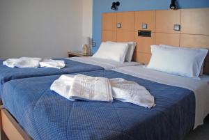 Posteľ alebo postele v izbe v ubytovaní Ermioni Hotel