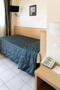 Postel nebo postele na pokoji v ubytování Hotel Fiera Rho