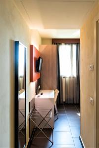 Postel nebo postele na pokoji v ubytování Hotel Fiera Rho
