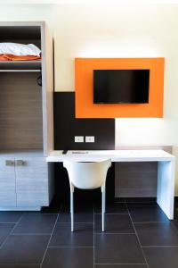 TV a/nebo společenská místnost v ubytování Hotel Fiera Rho