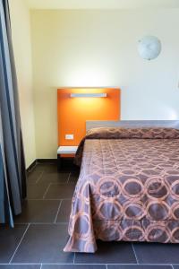 Postel nebo postele na pokoji v ubytování Hotel Fiera Rho