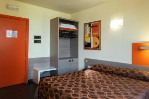 Postel nebo postele na pokoji v ubytování Hotel Fiera Rho