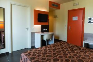 TV a/nebo společenská místnost v ubytování Hotel Fiera Rho