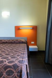 Postel nebo postele na pokoji v ubytování Hotel Fiera Rho
