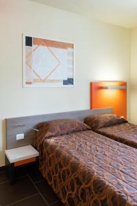 Postel nebo postele na pokoji v ubytování Hotel Fiera Rho