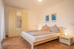 Postel nebo postele na pokoji v ubytování Haus Sonnenseite Wohnung Säntis