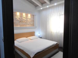 Posteľ alebo postele v izbe v ubytovaní Apartman Ines 1
