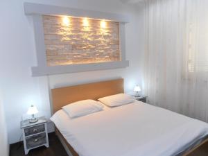 Posteľ alebo postele v izbe v ubytovaní Apartman Ines 1