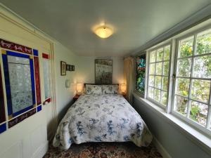 a bedroom with a bed and a window at Hawley House in Port Sorell