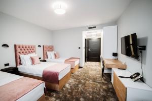 TV a/nebo společenská místnost v ubytování Hotel Barcode Wellness & Spa