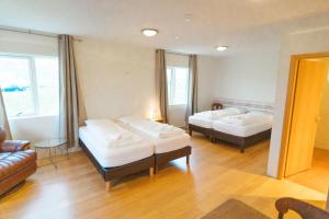 Postel nebo postele na pokoji v ubytování Álfheimar Hotel