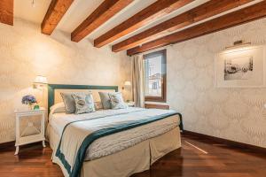 Postel nebo postele na pokoji v ubytování Ca' Della Luce Terrace