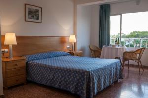 Postel nebo postele na pokoji v ubytování Apartamentos Top Secret Es Pujols - Formentera Vacaciones
