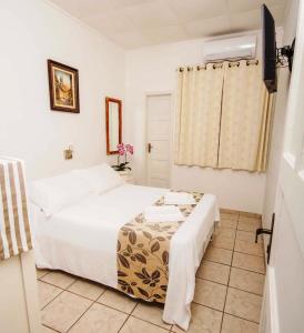 Postel nebo postele na pokoji v ubytování Hotel Cabana Suiça