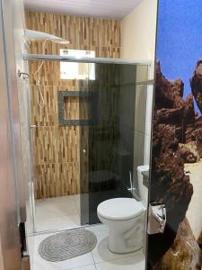 a bathroom with a shower with a toilet in it at Casa Ondas de Alter in Alter do Chao