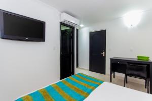 TV a/nebo společenská místnost v ubytování Hotel Bocagrande By GEH Suites