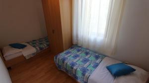 Łóżko lub łóżka w pokoju w obiekcie Apartment Turkalj