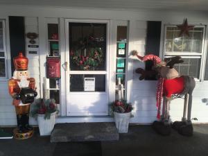 a front door of a house with christmas decorations at Starlight Lodge North Conway in North Conway