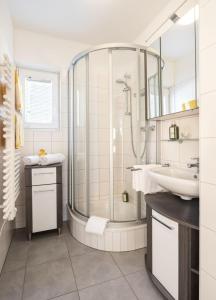 a bathroom with a shower and a sink at Fewo-Obertauern Alps in Obertauern