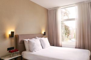 Postel nebo postele na pokoji v ubytování Alp de Veenen Hotel