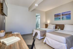 Postel nebo postele na pokoji v ubytování Tambaqui Praia Hotel